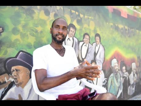 Nesta Andrews felt it was time to brighten the Arnett Gardens community with a mural that celebrates Jamaican culture and his community’s rich musical heritage.