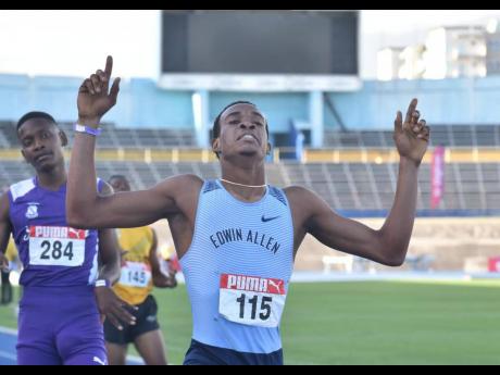 Edwin Allen High School's Delano Kennedy raises his hands to the sky after claiming the boys' 400-metre title at the JAAA Carifta Trials at the National Stadium earlier today.