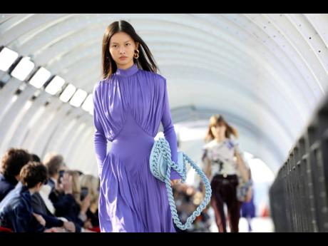 A model wears a creation for the Stella McCartney Ready To Wear Fall/Winter 2022-2023 fashion collection, unveiled during the Fashion Week in Paris.