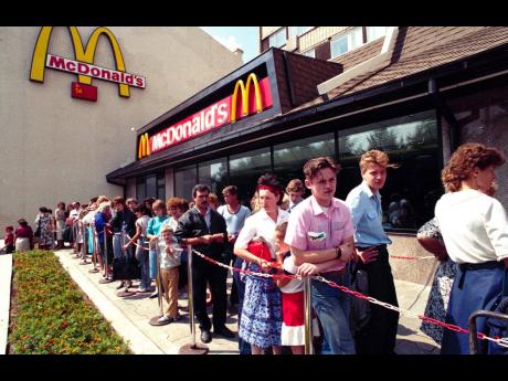 Russians wait in line outside a McDonald’s fast food restaurant in Moscow in 1991.