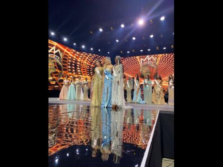 Miss World 2021 Karolina Bielawska (centre), is flanked by the United States' Shree Saini (left), first runner up in the 70th Miss World pageant and Olivia Yace, from Côte d'Ivoire, the second runner-up. 