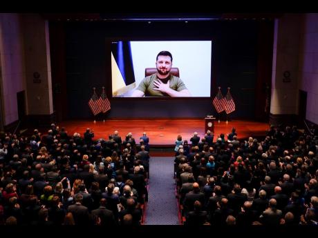 Ukrainian President Volodymyr Zelenskyy speaks via viedo to the US Congress at the Capitol in Washington yesterday, to plead for support as his country is besieged by Russian forces.