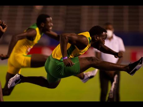 From left: Jahvelle Granville and Demario Prince performing at the Carifta Trials last weekend.
