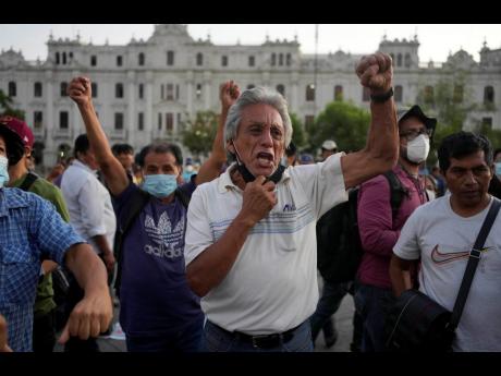 Demonstrators protest against the decision of Peru’s Constitutional Court approving the release from prison of former President Alberto Fujimori in Lima, Peru on Thursday.