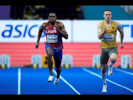 Christian Coleman of the United States, and Aleksandar Askovic, of Germany, right, compete in in a Men's 60-metre heat at the World Athletics Indoor Championships in Belgrade, Serbia, earlier today.