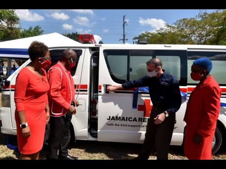 Credit: Kenyon Hemans From left: Susan Moore, vice-president, Jamaica Red Cross (JRC); Martin Gooden, chairman, finance committee, JRC; Daniel Caron, country manager, Nestle Jamaica Limited; and Yvonne Clarke, director general, JRC, after Nestle donated an ambulance to the Jama