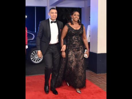 Credit: Kenyon Hemans Prime Minister Andrew Holness enters King’s House with wife Juliet, member of parliament for St Andrew East Rural.