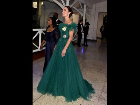 Credit: Kenyon Hemans Duchess of Cambridge Kate paid tribute to Jamaica’s national flag in an off-the-shoulder, green tulle bespoke Jenny Packham dress.
