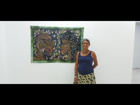 Credit: Krysta Anderson Margaret posing proudly beside her creation, ‘Hair Today, Gone Tomorrow’.