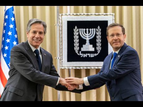 US Secretary of State Antony Blinken (left) and Israel’s President Isaac Herzog pose for a photo in Jerusalem. 