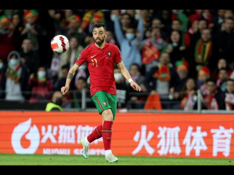 Portugal’s Bruno Fernandes eyes the ball during the World Cup 2022 playoff match between Portugal and North Macedonia, at the Dragao stadium in Porto, Portugal on Tuesday, March 29.