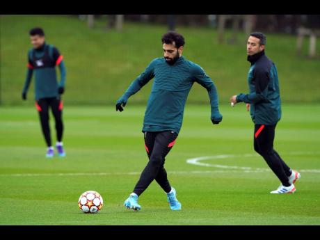 Credit: AP Liverpool’s Mohamed Salah attends a training session, ahead of today’s Champions League first-leg, quarter-final match against Benfica, at the AXA Training Centre, Liverpool, yesterday.