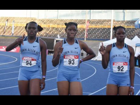 Edwin Allen High School’s (from left) Serena Cole and Tia and Tina Clayton.