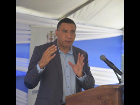 Credit: Photo by Herbert McKenis Prime Minister Andrew Holness speaking at the groundbreaking ceremony for the new Little London Police Station in Westmoreland on Thursday.
