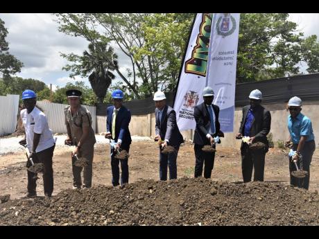 Prime Minister Andrew Holness (centre) participates in the groundbreaking for the construction of the Little London Police Station in Westmoreland. From left are Desmond McKenzie, minister of local government and rural development; Deputy Commissioner of P