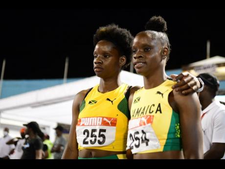 Jamaica's Tina Clayton (right) and Tia Clayton, gold and silver medallists respectively in the Girls U20 100m final at the Carifta Games in Kingston on Saturday.