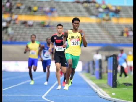 Jamaica's J'Voughnn Blake pushes the pace in the Boys' Under-20 800 metres on his way to a gold medal at the 49th Carifta Games inside the National Stadium this evening.