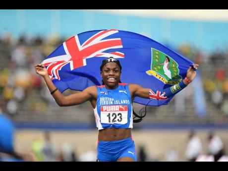 Credit: Gladstone Taylor The British Virgin Islands' Adaejah Hodge celebrates winning the girls' Under-17 200 metres at the 49th Carifta Games inside the National Stadium earlier this evening.