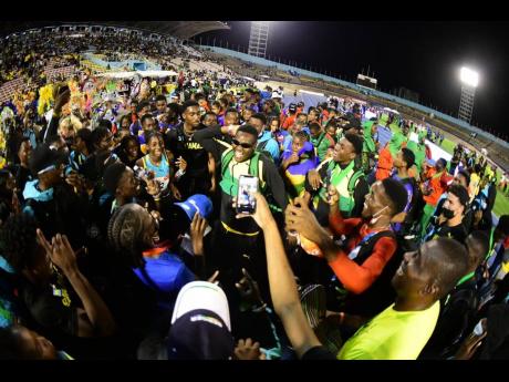 Athletes, coaches and administrators celebrate a successful end to the 49th Carifta Games inside the National Stadium this evening.