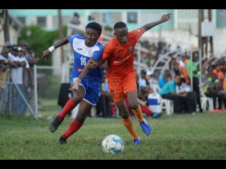 Credit: File Tivoli Gardens FC’s Trayvon Reid (right) challenges Roberto Johnson of Portmore United during a premier league match at the Edward Seaga Sports Complex on Sunday, November 17, 2019.