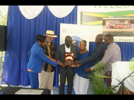 From left: Deputy Mayor of Lucea, Councillor Andria Dehaney-Grant; co-founder and Chairman of Unconditional Love for Children Inc, Dr Earl Glenn; Mayor of Lucea, Councillor Sheridan Samuels; Mrs Carolyn Glenn; Devon Brown and Daren Barnes, councillors for 