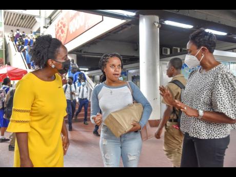 State Minister in the Ministry of Wellness Juliet Cuthbert-Flynn (right) and Dr Cathi-Ann Williams (left), NCD Risk Factor Programme Development Officer, Non-Communicable Disease and Injury Prevention Unit, Ministry of Health and Wellness, speak to Renae R