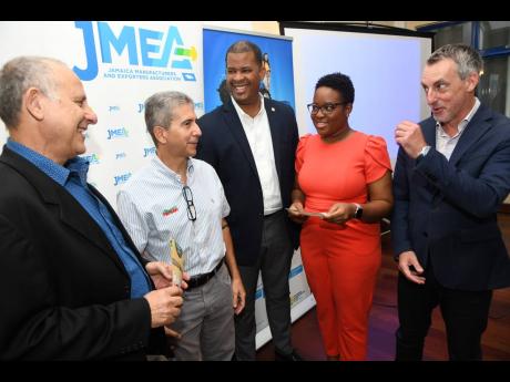 Rudolph Brown/Photographer 
From left: JMEA President John Mahfood interacts with Managing Director of Newport-Fersan Jamaica Limited Dennis Valdez, CEO of GraceKennedy Foods - Domestic Business Frank James, JMEA Executive Director Kamesha Blake, and CEO o