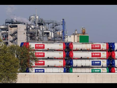 AP 
Containers labelled ‘BASF’ stand on the site of the chemical company BASF in Ludwigshafen, Germany, on Thursday, April 28. The company would be severely affected by a potential Russian gas supply stop.  