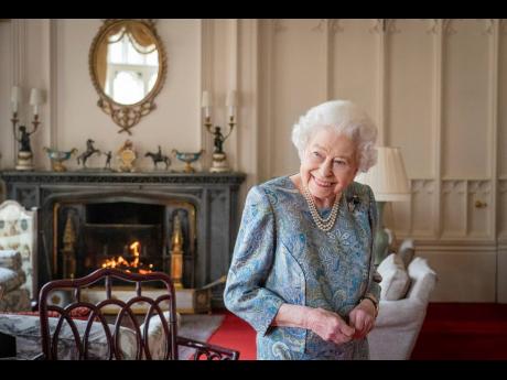 
Britain’s Queen Elizabeth II smiles while receiving the President of Switzerland Ignazio Cassis and his wife Paola Cassis during an audience at Windsor Castle in Windsor, England.