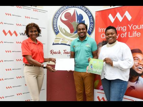 From left: Samantha Charles, chief executive officer, VM Foundation; Andre Witter, project coordinator, Jamaica Sign Language Heartbeat; and Keisha Cameron, innovations research analyst, VM Innovations. VM Group and VM Foundation team members donated to th