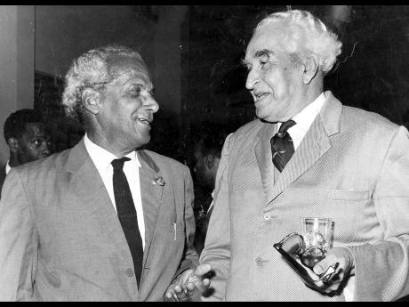 In this 1969 photo, two famous cousins and national heroes, Sir Alexander Bustamante (right) and Norman Manley, greet each other at the Jamaica Broadcasting Corporation’s building in Kingston.