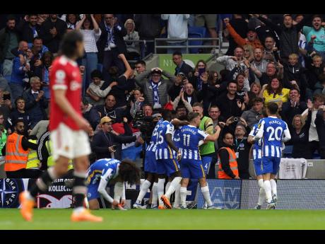 
Brighton and Hove Albion’s Leandro Trossard (centre right) celebrates scoring their side’s third goal of the game during the English Premier League soccer match between Brighton & Hove Albion and Manchester United at the AMEX Stadium, Brighton, Englan