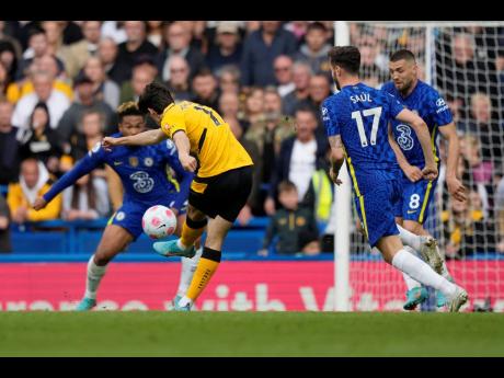 Credit: AP
Wolverhampton Wanderers’ Francisco Trincao (second from left) scores his side’s opening goal during the English Premier League soccer match between Chelsea and Wolverhampton at Stamford Bridge stadium, in London yesterday.