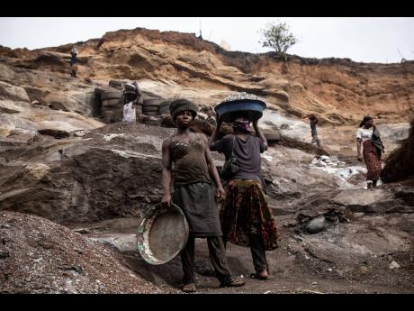 Women work in a Pissy granite mine in Ouagadougou, Burkina Faso.