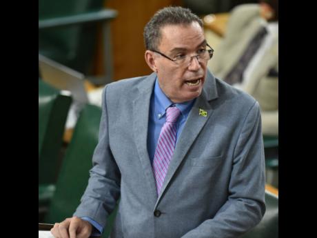 Daryl Vaz, minister of science, energy and technology, addresses lawmakers during the Sectoral Debate on Tuesday.