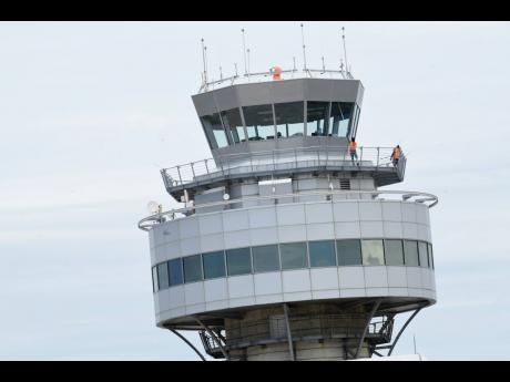 Credit: File The air traffic control tower at the Norman Manley International Airport stood empty as staff withdrew services last Thursday.