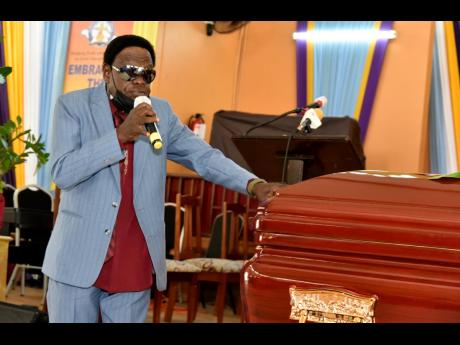 Judge Diamond of reggae group the Mighty Diamonds, gives a musical tribute during last Wednesday’s thanksgiving service for the life of his friend and group member Fitzroy ‘Bunny Diamond’ Simpson.