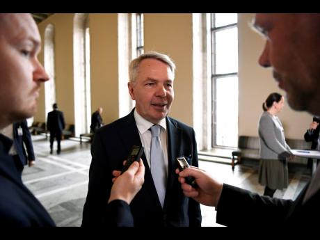 Finnish Foreign Minister Pekka Haavisto gives a statements to media after Finnish parliament voted on NATO membership in Helsinki, Finland, Tuesday, May 17.