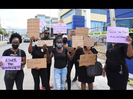 Credit: Ian Allen/Photographer Students of the University of the Commonwealth Caribbean demonstrate against a hike in tuition fees outside the Worthington Avenue, New Kingston campus on Wednesday.