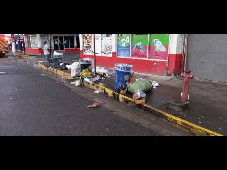 Garbage strewn along Harbour Street in Port Antonio, Portland.