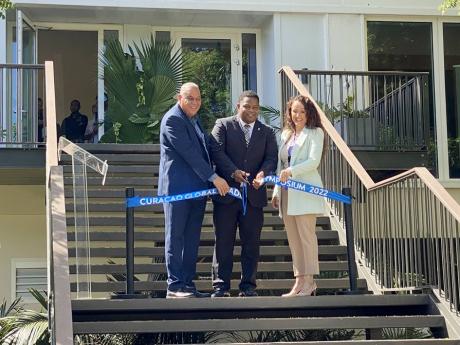 Credit: Contributed From left: Hugo Clarinda, senior management assistant, Curaçao Tourist Board; Ruisandro Cijntje, minister of economic development in Curaçao; and Maria Elena Seferina, managing director of Curaçao Hospitality & Tourism Association, at the opening of the