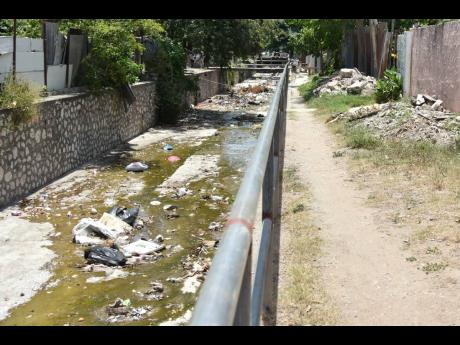Credit: Kenyon Hemans Sandwiched by newly built high-rise residential complexes – and edging the potentially deadly Sandy Gully during heavy rains – Sandy Park in St Andrew stands out among the landscape.