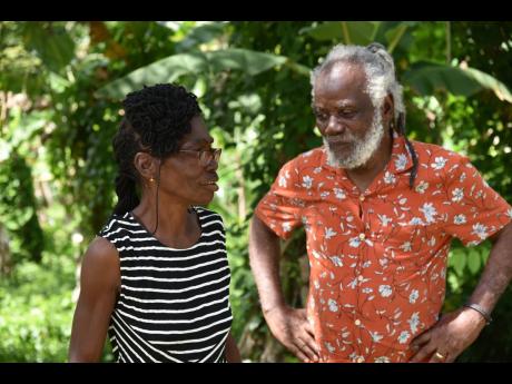 Credit: Mark Titus Community activist O. Dave Allen and community leader Ingrid Kerr founded the Retirement Development Trust to help regularise captured lands in Retirement, St James.