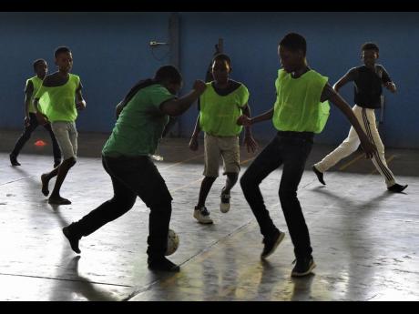 At-risk youths playing Futsol (Brazillian scrimmage) during UpRising Academy’s two-day STEM and Futsol Camp.  