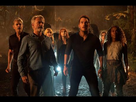 From left: Jeff Goldblum, Sam Neill, Laura Dern, Bryce Dallas Howard, Chris Pratt, Isabella Sermon and DeWanda Wise in a scene from ‘Jurassic World Dominion’.