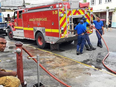 Credit: Carl Gilchrist A fire truck from the Ocho Rios Fire Station refills at a fire hydrant along Main Street, Ocho Rios.