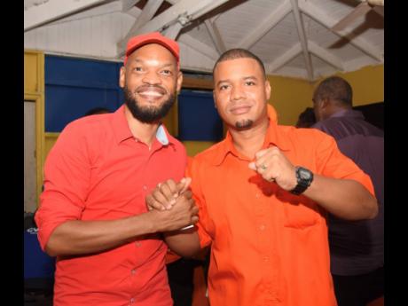 People’s National Party (PNP) candidate, O’Neil Buchanan (right), (Brompton Division, St Elizabeth) shakes hands with PNP chairman of East Central St Catherine, Raymond Pryce, at the divisional conference in Brompton, St Elizabeth, on Sunday.