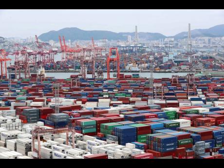 Credit: AP Piled up containers are seen at a port in Busan, South Korea, Monday, June 13, 2022, following a week-long strike by truckers.