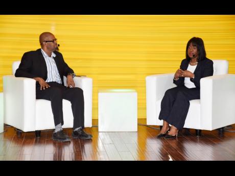 Lloyd Waller (left), professor of digital transformation policy and governance in the Department of Government, The UWI, Mona campus; and Jamaican Jacky Wright, chief digital officer and corporate vice-president of Microsoft, participate in a panel discuss