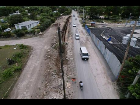 Roadwork under way in Yallahs, St Thomas, where Part D of the South Coast Highway Improvement Project stretches from the Yallahs Bridge in St Thomas to Port Antonio in Portland.